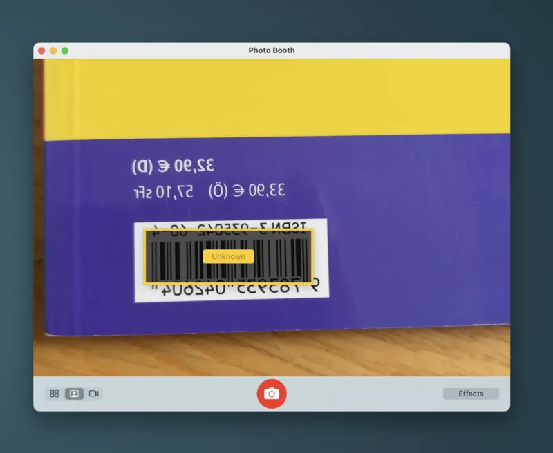 A camera view scanning a barcode on a book, ready to be appended to a catalog